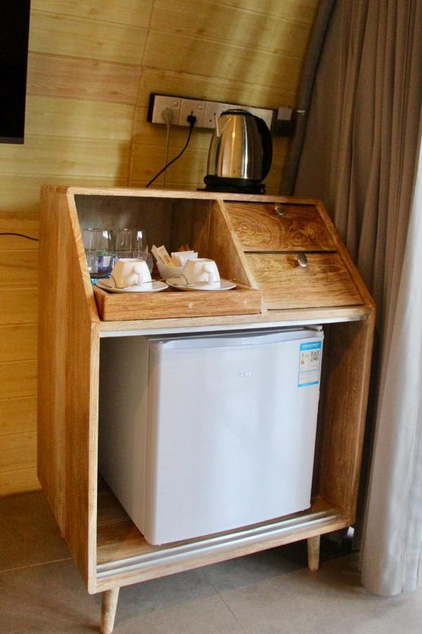 Nivadoo Resort Sigiriya Exteriör bild A small refrigerator in a hotel room